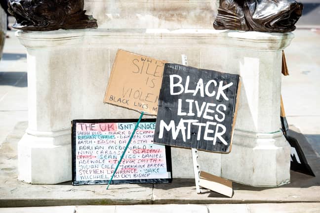 Black lives matter signs at base of statue (Alamy)